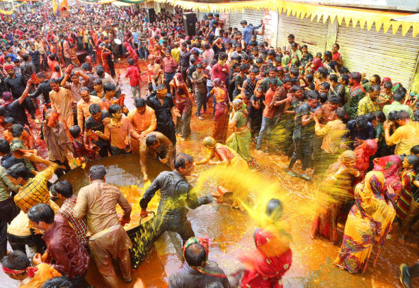 Beawar, Rajasthan, March 25, 2016: Devar (brother-in-law) thrown colorful water on Bhabhi (sister-in-law) and women beat men with ropes as per traditional culture Kodamar Holi festival in Beawar.